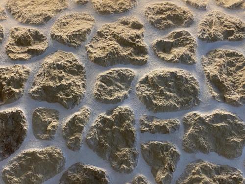 a group of rocks in the water at Kores of Poros in Poros