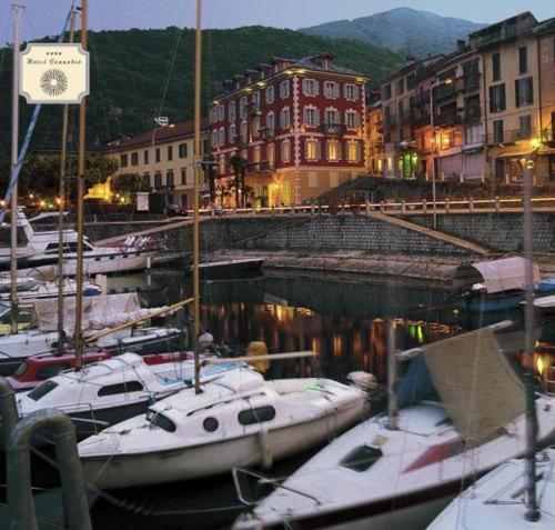 a group of boats docked in a marina at night at Hotel Cannobio in Cannobio
