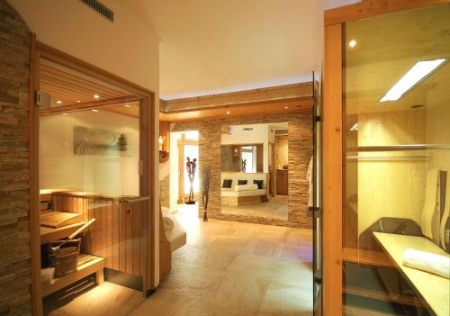 a bathroom with a large glass door leading to a bedroom at Haus Schwarzenberg in Stummerberg