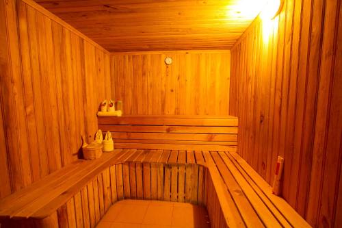 a wooden sauna with a bench in the middle at Temple Tree Resort & Spa, Pokhara in Pokhara