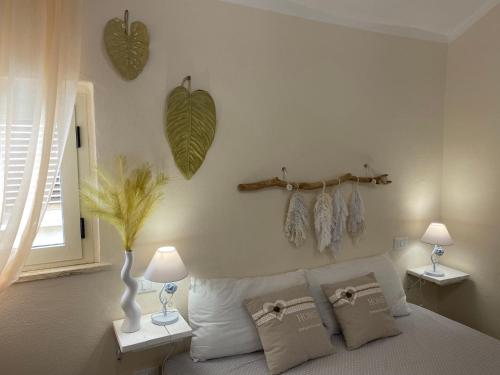 a bedroom with a bed and two tables with lamps at Azienda agricola Villa Giorgio in Torino di Sangro