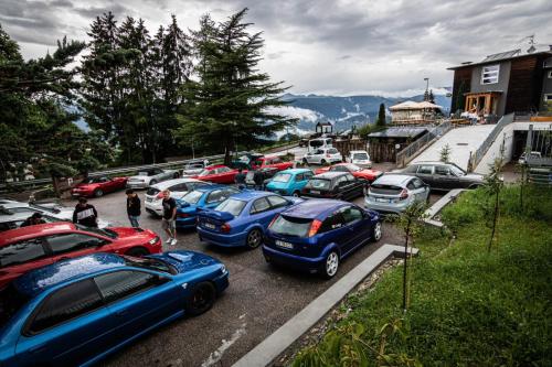 a bunch of cars parked in a parking lot at Hotel Villa Argentina Ronzone in Ronzone
