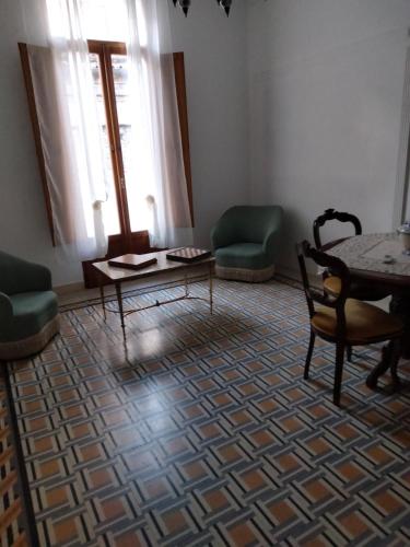 a living room with a table and chairs at Don Aniello Alloggio Turistico in Sulmona