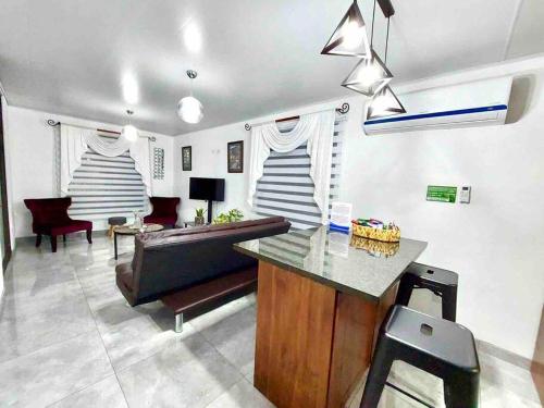 a living room with a couch and a table at Airport SJO Residence - Edward & Familia Inn in Alajuela City
