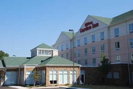 a large hotel with a building in front of it at Hilton Garden Inn Birmingham/Trussville in Trussville