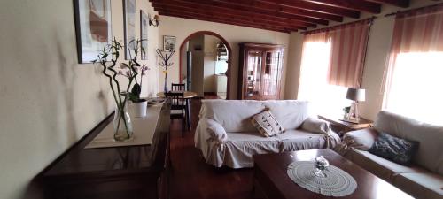 a living room with a couch and a table at Ático El Marquito in Santa Cruz de la Palma