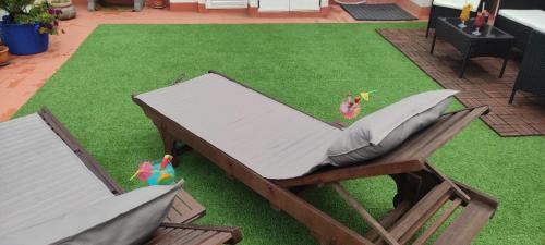 a bed with a pillow on top of a lawn at Ático El Marquito in Santa Cruz de la Palma