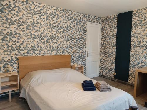 Ένα ή περισσότερα κρεβάτια σε δωμάτιο στο gîte du Laïka