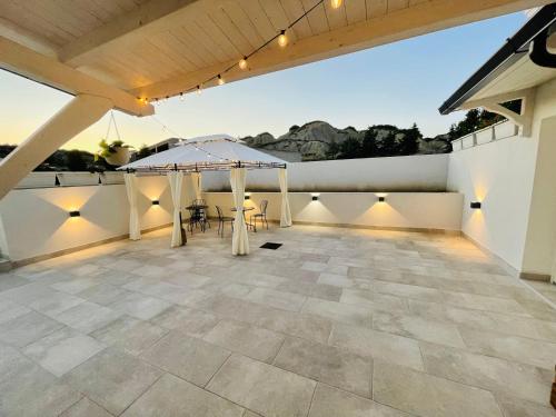 a patio with a table and chairs on a roof at Il Casale dei Calanchi in Aliano
