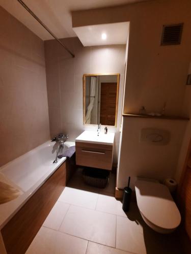 a bathroom with a sink and a mirror at St Catherine - Sweet home - Bxl - Studio Apartment with city view in Brussels