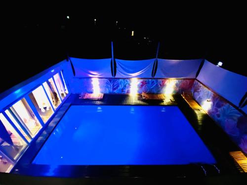 an overhead view of a pool at night at Exclusive Villa Larnaca - 8 plus sleeps - 2 min from BEACH - Big Private Pool in Pyla