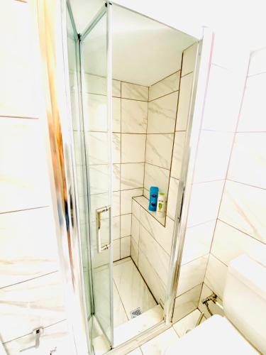 a shower with a glass door in a bathroom at Exclusive Villa Larnaca - 8 plus sleeps - 2 min from BEACH - Big Private Pool in Pyla