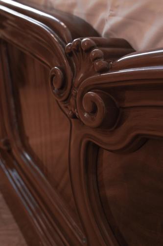 a close up of a wooden bed frame at Villa Avoti in Sigulda