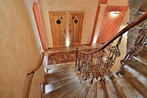 a staircase in a house with a wooden cabinet at Rezidence Mandragora in Pardubice