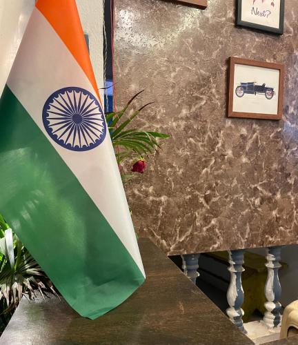 a flag sitting on a table next to a wall at RJ14 Accommodations at Baga Beach in Baga