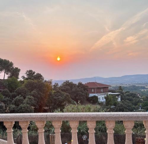 a view of a sunset from a balcony of a house at Paradise in Aldea del Fresno