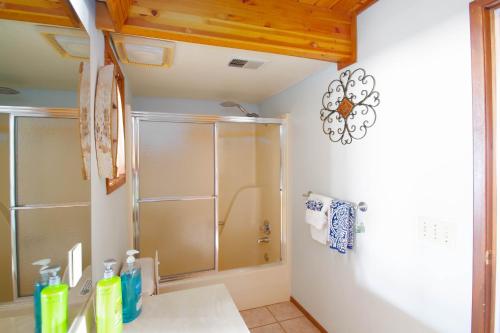 a bathroom with a shower and a glass shower stall at Lakefront with Hot Tub/Sauna-Beaver Lake,Arkansas in Garfield