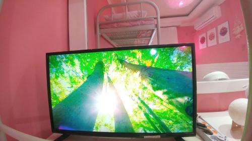 a computer monitor sitting on a table in a room at Spring Light in Seoul