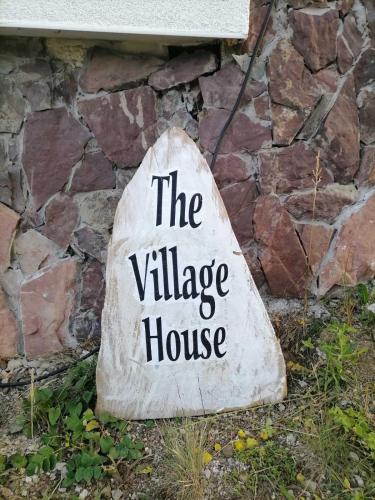 a stone sign that reads the village house at The Village House Zlatar in Nova Varoš
