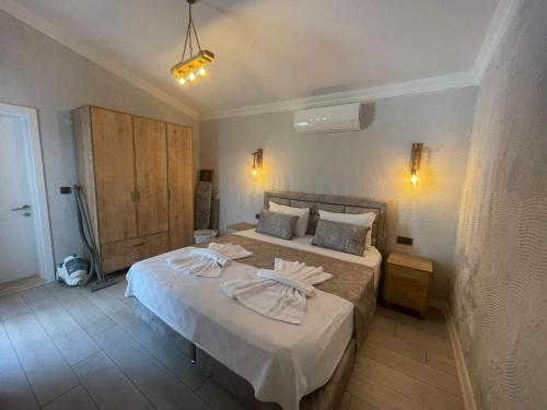 Postel nebo postele na pokoji v ubytování Kaya Koy Tatil Evleri Villas