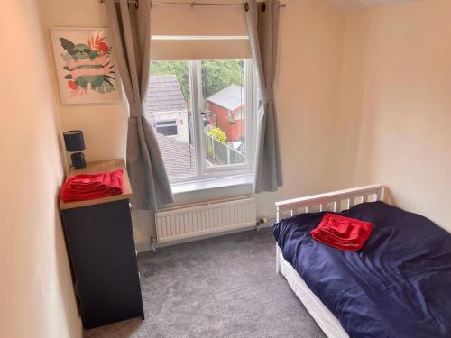 a bedroom with a bed and a window at Lovely 3BD Home in the Heart of Morton in Morton