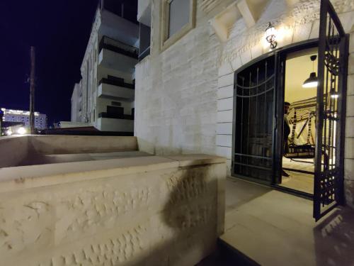 an entrance to a building with a wrought iron gate at bedroom (3) apartment of 200 square meters with an outdoor terrace in Umm Uthainah
