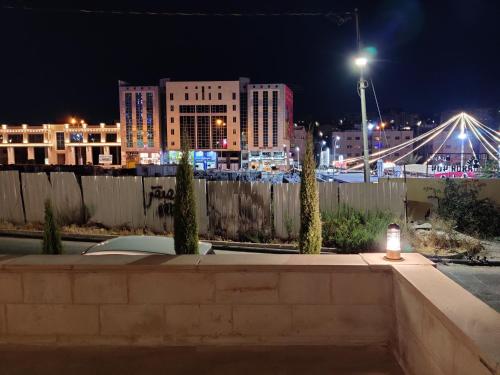 a view of a city at night with a bridge at bedroom (3) apartment of 200 square meters with an outdoor terrace in Umm Uthainah