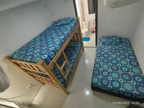 Voodi või voodid majutusasutuse Hermoso Apartamento en Santa Marta toas