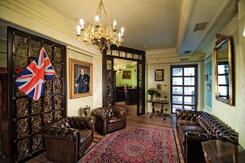 a living room filled with furniture and a fire place at British Club Lviv in Lviv
