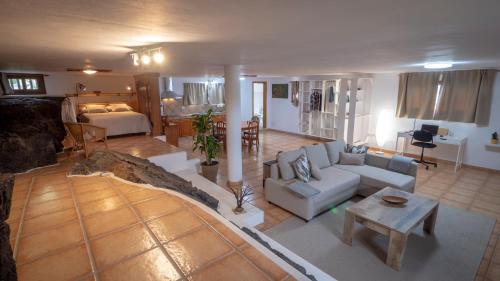 a large living room with a couch and a table at Casa Ico Lanzarote in Tías