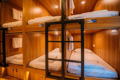 a room with bunk beds in a boat at Bluewaters Pods 38 Hongkong St in Singapore