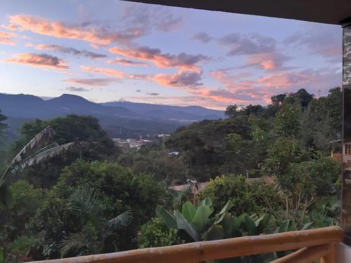 a sunset view from the balcony of a house at Hospedaje Rural El Rancho de Amelia y Juancho in Silvania
