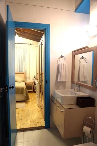 a bathroom with a sink and a mirror at Cypriot Swallow Boutique Hotel in North Nicosia
