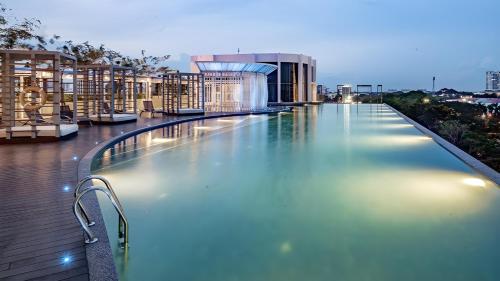 a swimming pool on the roof of a building at #Free Netflix 1BR Troika Residensi Kota Bharu By AGhome in Kota Bharu