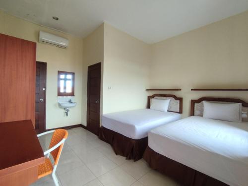 Katil atau katil-katil dalam bilik di Adi Pelita Sari Bali