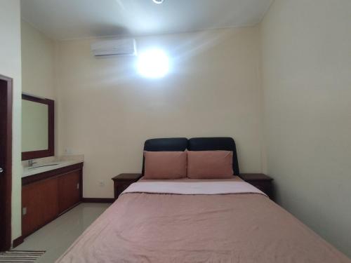 Katil atau katil-katil dalam bilik di Adi Pelita Sari Bali