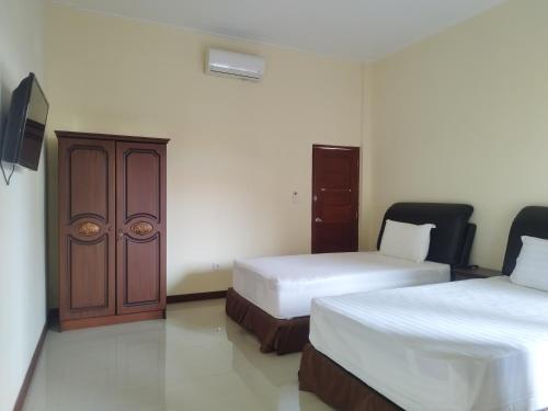 Katil atau katil-katil dalam bilik di Adi Pelita Sari Bali