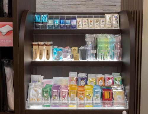 a shelf filled with lots of different colored items at Sanco Inn Grande Tokyo Hamamatsucho in Tokyo