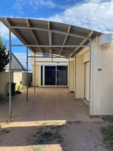 a patio with awning on top of a building at Bayview Retreat - Esplanade home w wifi in Wallaroo