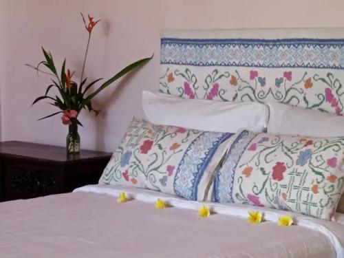 Postel nebo postele na pokoji v ubytování Orchid House