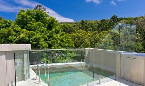 a swimming pool on the roof of a house at Little Cove Court - Apt 10 in Noosa Heads
