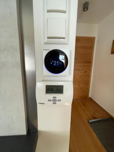 a machine with a clock on top of it at Mini-Apartment Admont in Admont