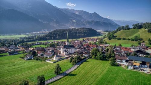 an aerial view of a small town in a green field at Waldruh in Wiesing