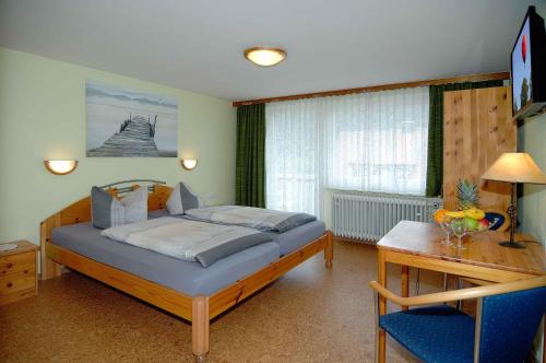 Postel nebo postele na pokoji v ubytování Hotel Bellevue