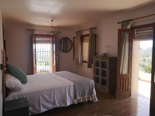 A bed or beds in a room at Ca Olivar