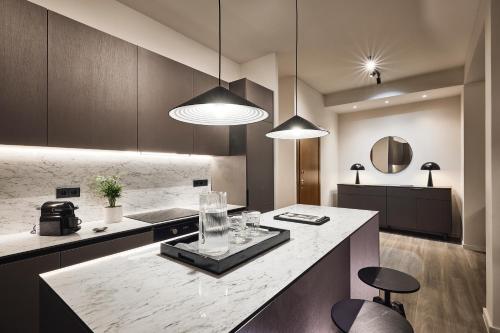 a kitchen with a island with a counter top at Acropolis Panorama Residence in Athens