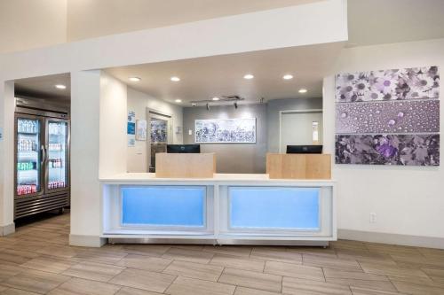 a lobby of a store with a reception counter at Sleep Inn & Suites Tempe ASU Campus in Tempe
