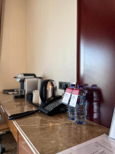 a bottle of water sitting on top of a counter at Velvet Hotel Jeddah in Jeddah
