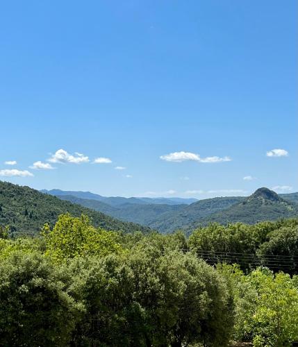 a view of the mountains from the top of a hill at Panthoron Tzoumerka in Vourgareli