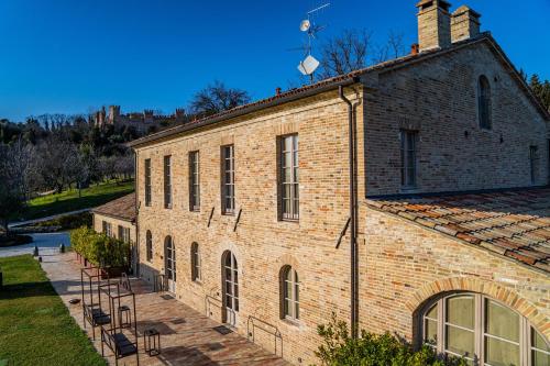 an old brick building with a group of windows at Terra di Gradara in Gradara